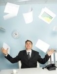 8432880-bureaucrat--a-businessman-juggling-documents-as-a-magician